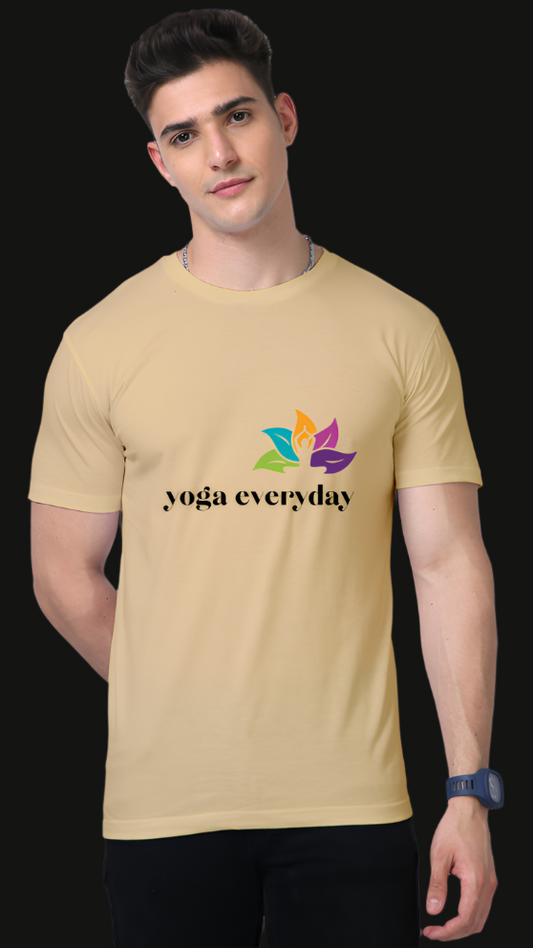ViNK Lotus Awakening Supima Cotton beige unisex yoga-everyday t-shirt - Model showcasing a front view that features front features a vibrant lotus flower composed of multi-colored petals — green for growth, blue for tranquility, purple for spiritual wisdom, and orange for energy — surrounding a meditative figure at the center, paired with the text "yoga everyday," beautifully symbolizing the journey of daily mindfulness, balance, and inner awakening